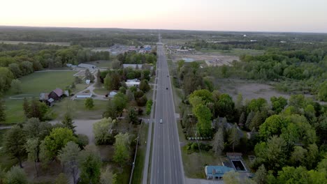 Highway-road-leading-to-small-town-of-Clare,-aerial-drone-view