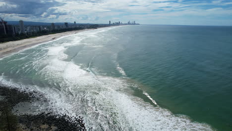 burleigh heads coastline with surfers paradise skyline in the distance, aerial view