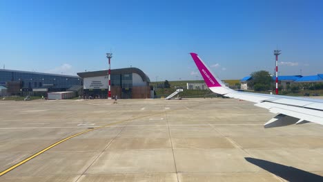 plane window view takeoff suceava airport in romania, fly airplane wing view