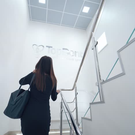 woman indoors on the stairs