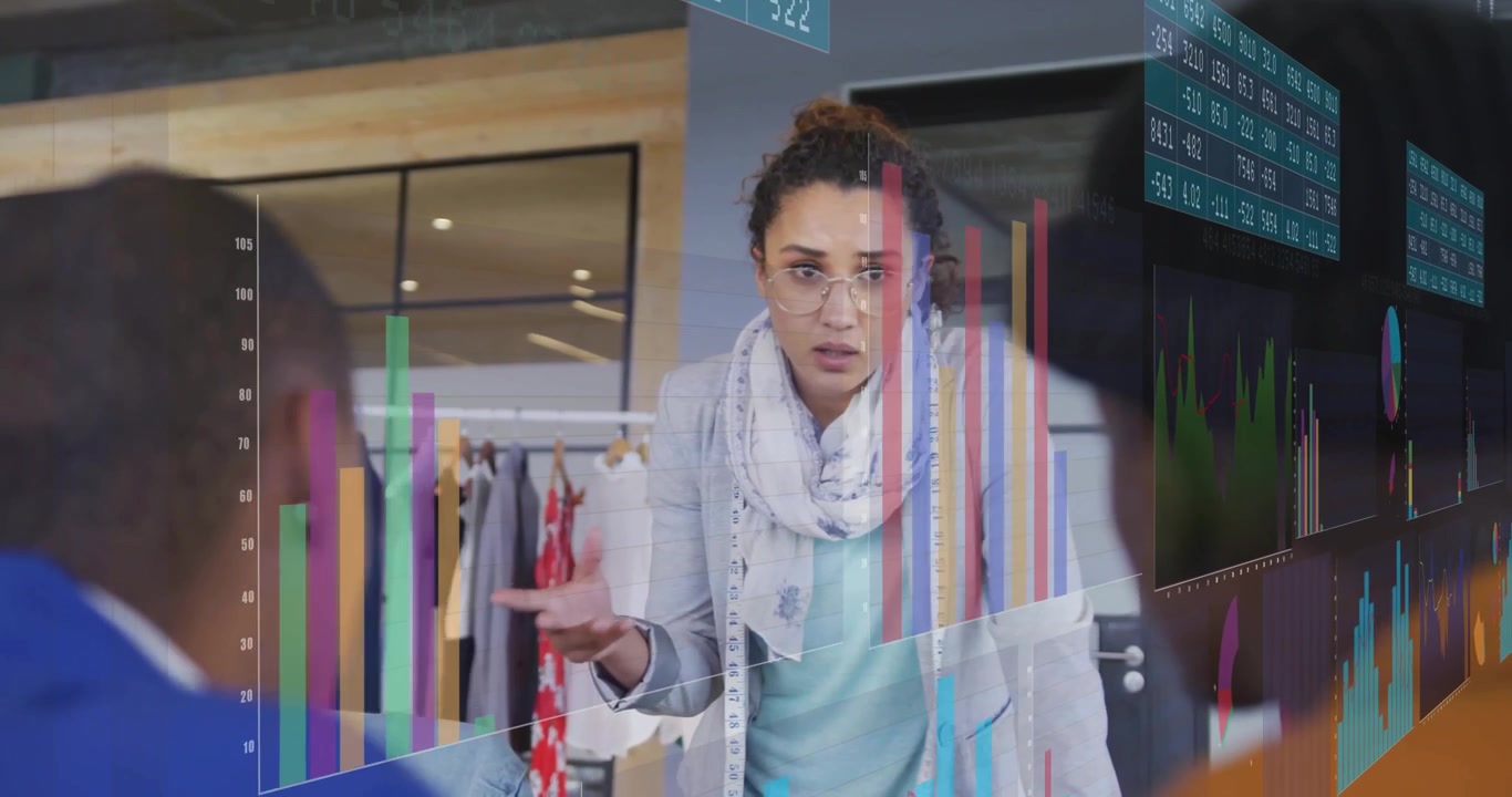 Woman presenting observing chart update and explaining sales dip and growth with data overlays