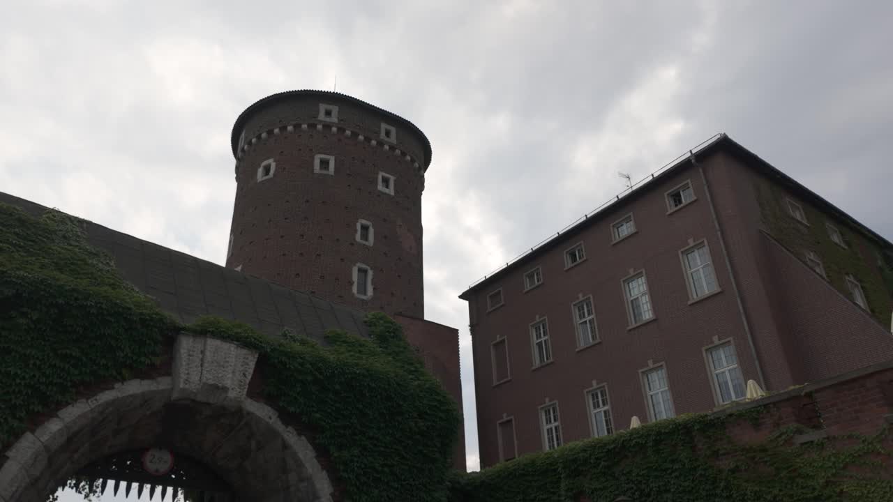 Pan across Sandomierska Tower at Wawel Castle, an iconic historic tower in Krakow, Poland