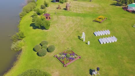 green site prepared for wedding ceremony by lake upper view