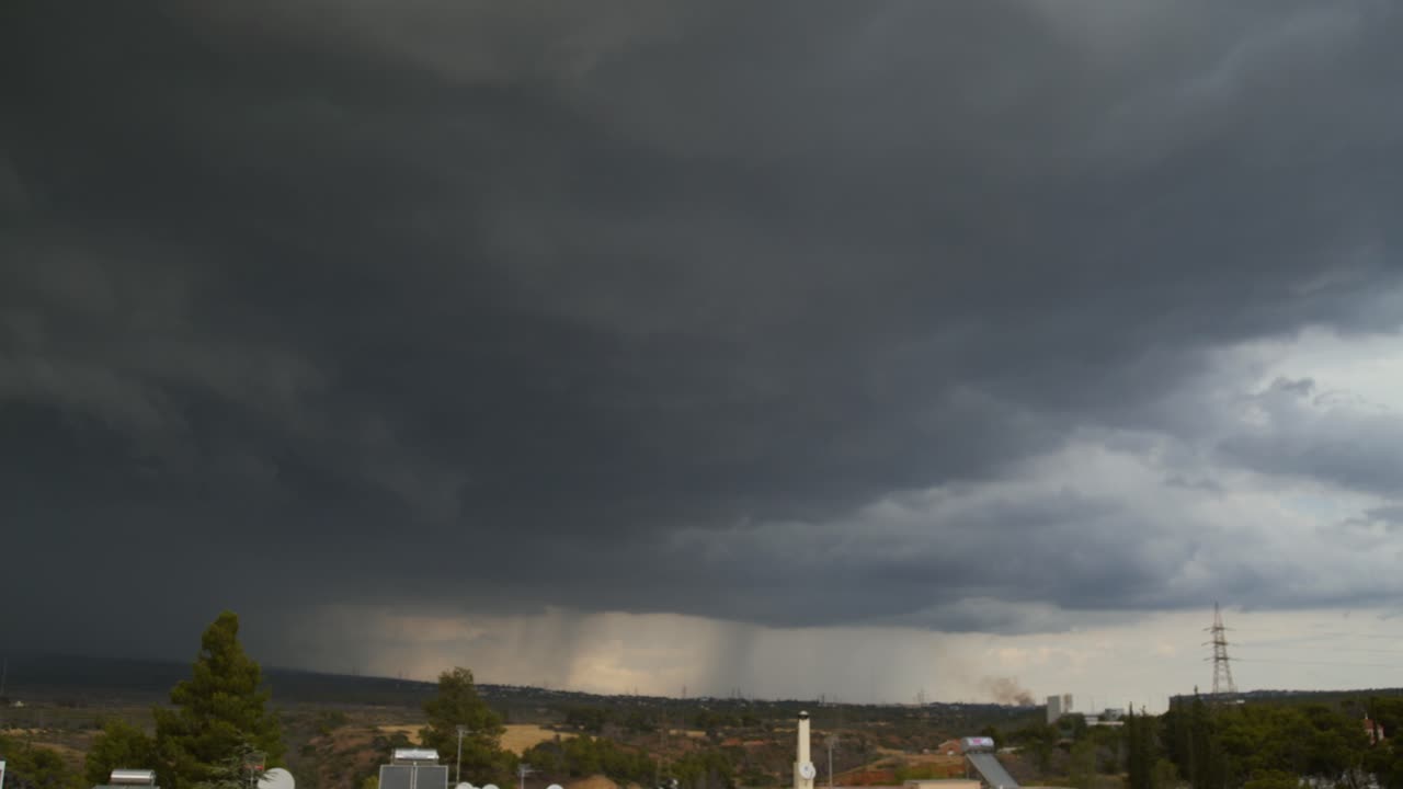 Slow left pam 4k panorama footage of intense thunderstorm over Parnitha mountain, Greece
