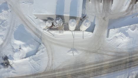 aerial view of snow-covered industrial facility