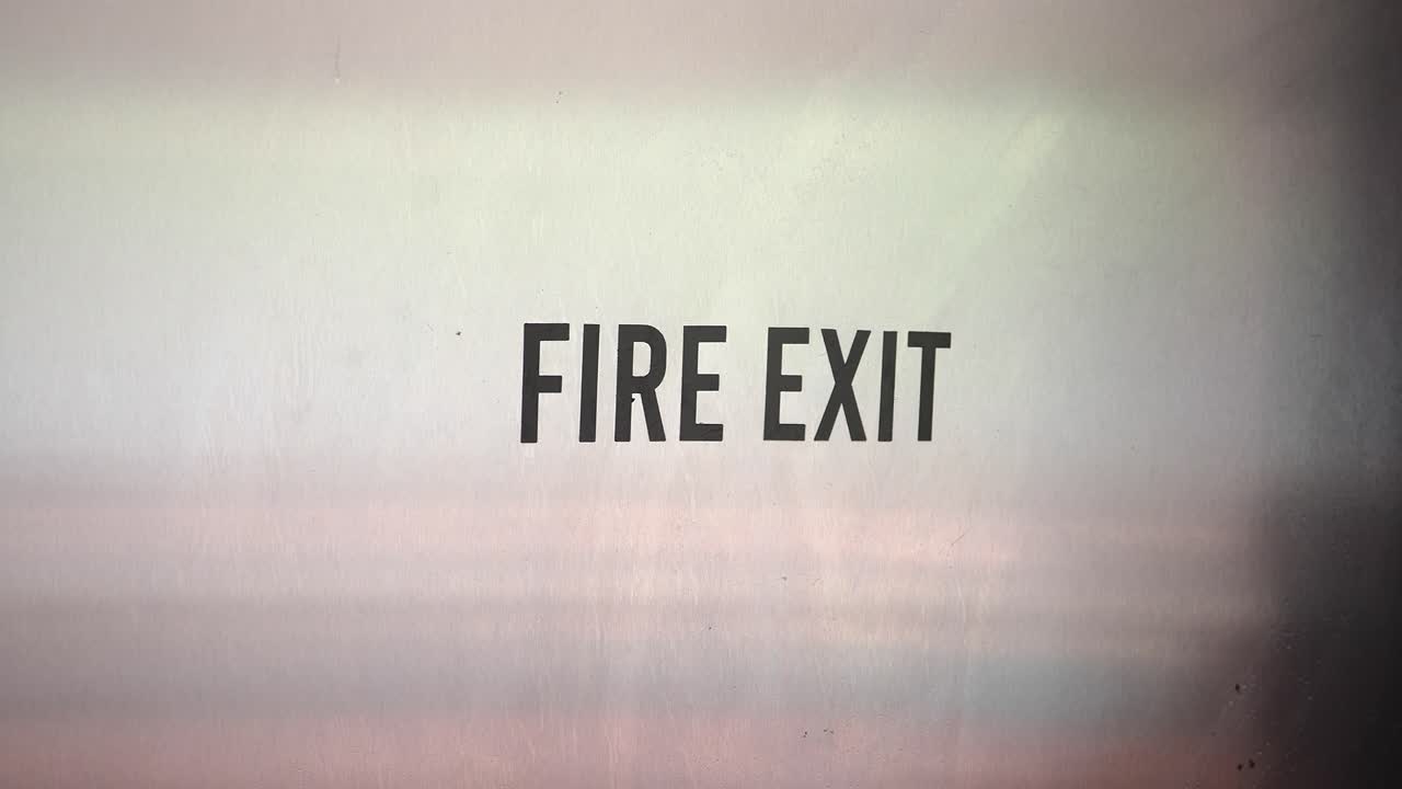 Fire Exit Sign on Metallic Door