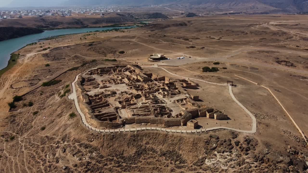 Breathtaking aerial view of Sumhuram, Oman! A UNESCO World Heritage Site and ancient frankincense port. Watch now!