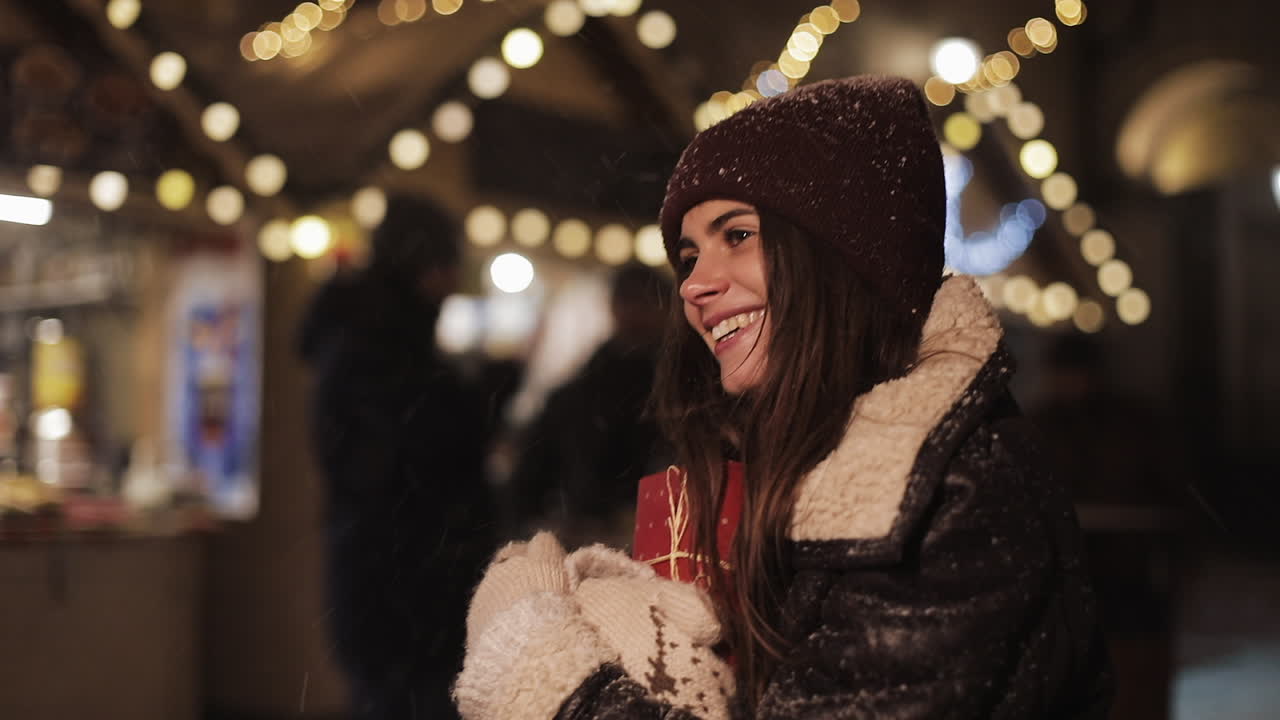 Woman at a Christmas Market in the Snow