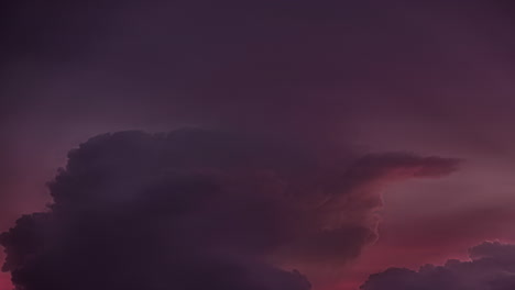 Red-sunset-cloudscape-roll-in-dark-sky,-fusion-time-lapse