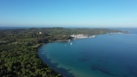 Porquerolles-beach-and-harbor-suynny-day-aerial-shot-France-Hyères-island