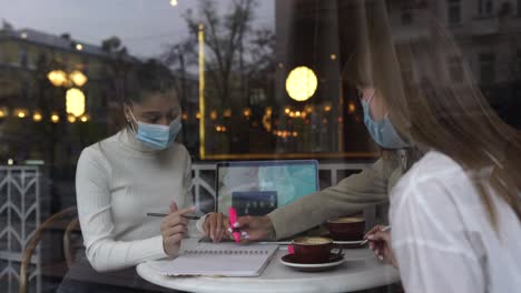 businesswomen meeting in a cafe