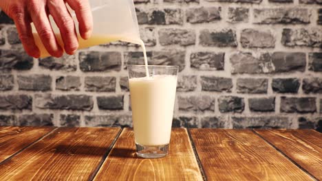 pouring a glass of fresh white milk