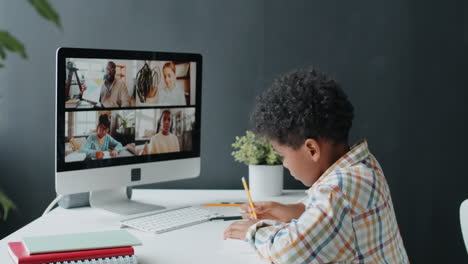 african american boy taking online class at home