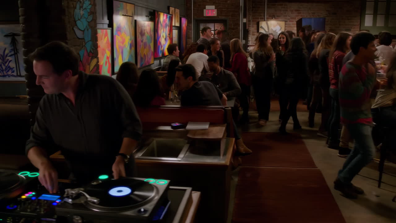 Lively Art Gallery Bar with DJ and Socializing Crowd