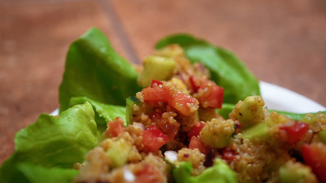 Macro view of stuffed lettuce wraps on a plate for an appetizer