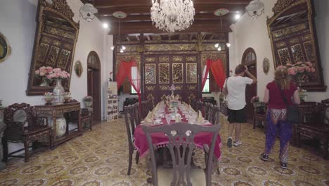 traditional asian oriental dining table in public museum, flyover shot