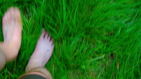 walking barefoot on green grass