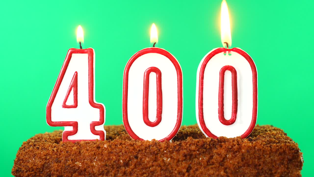 Cake with the number 400 lighted candle. Chroma key. Green Screen. Isolated