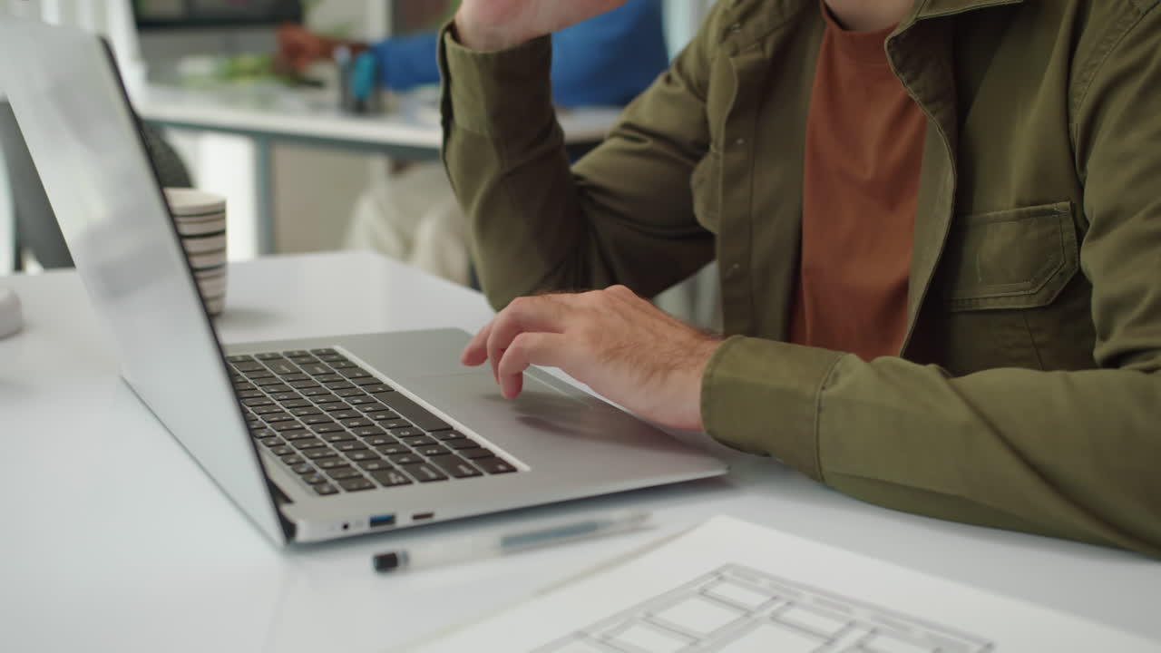 IT Consultant Calling Client via Smartphone at Startup Office
