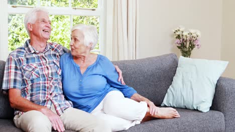 Senior-couple-talking-in-sitting-room