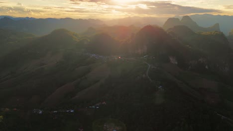 aerial of ban jabo remote village in mae hong son province of norther thailand , sunset drone footage