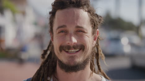 portrait-of-young-friendly-man-smiling-cheerful-on-busy-beachfront-background