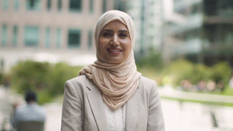 Portrait-Of-Muslim-Businesswoman-Outdoors-Standing-In-Front-Of-City-Offices-1