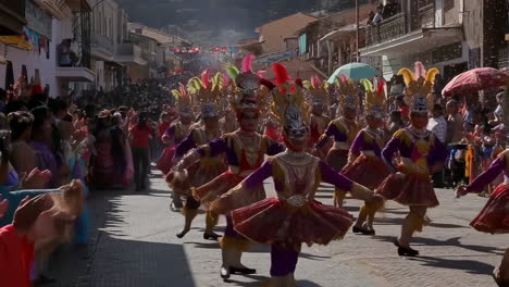 cultural street parade with dancers in elaborate costumes