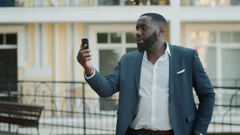 African-american-business-man-having-fun-outdoors.-Afro-manager-dancing-outside