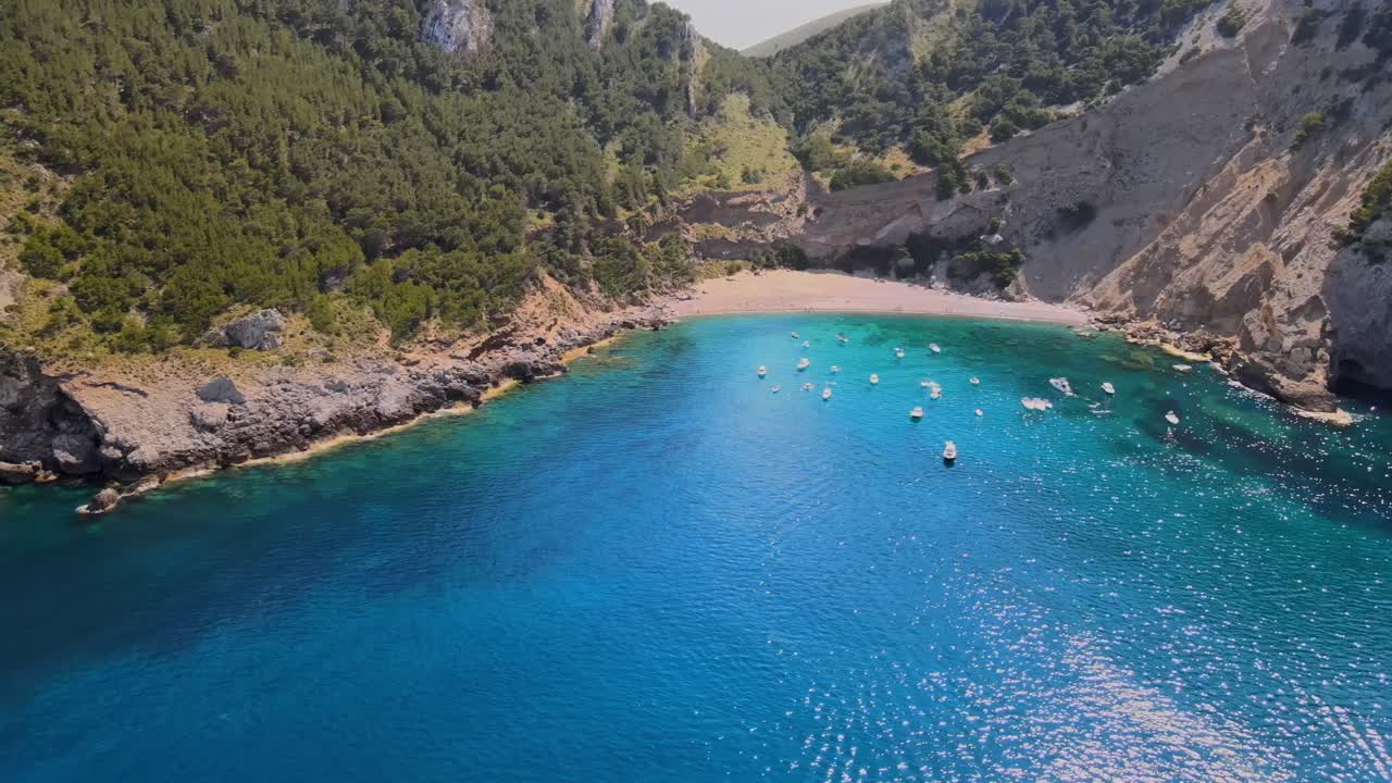 Experience the tranquil shores of Coll Baix in Mallorca. Clear blue waters and hidden coves invite relaxation and exploration. Enjoy the natural landscape that captures the essence of Majorca.