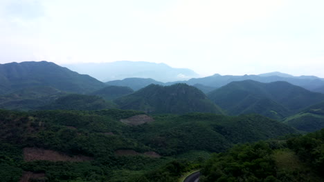 aerial wide view of the mountains near the city of oaxaca, mexico, filmed by a drone with tilt-up displacement