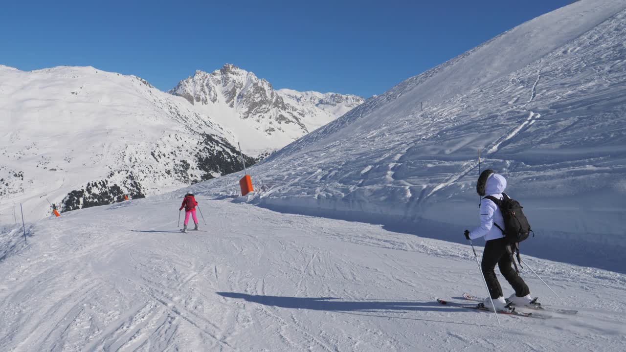 Two Skier Woman Skiing Carving Style On The Mountain Slope In Winter