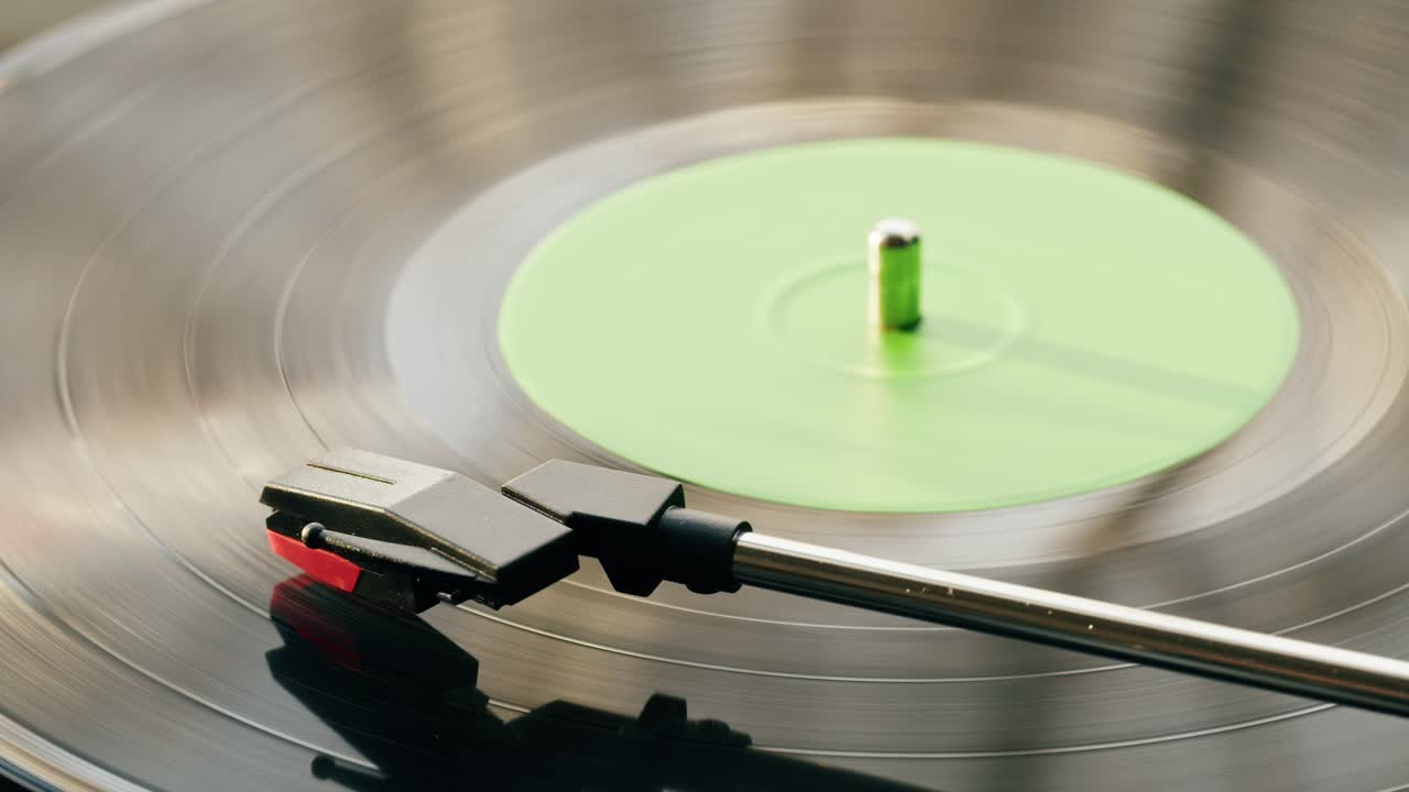 Close-up of a Vinyl Record Spinning on a Turntable with Needle