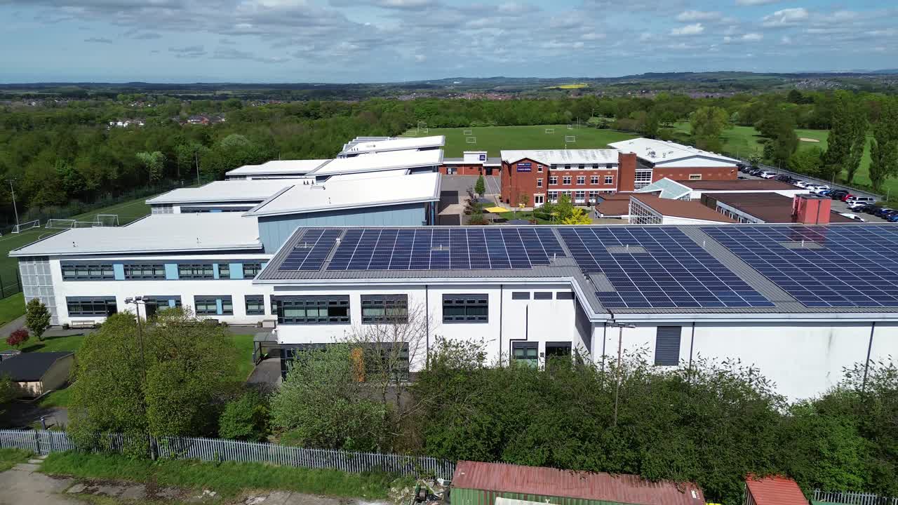 Modern solar powered college faculty roof aerial view orbiting ...