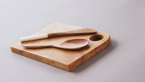 Wooden-spoon-and-spatula-on-wooden-board