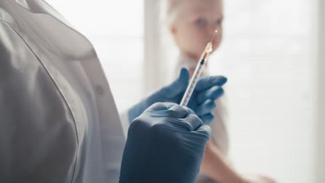 caucasian elementary age girl during vaccination.