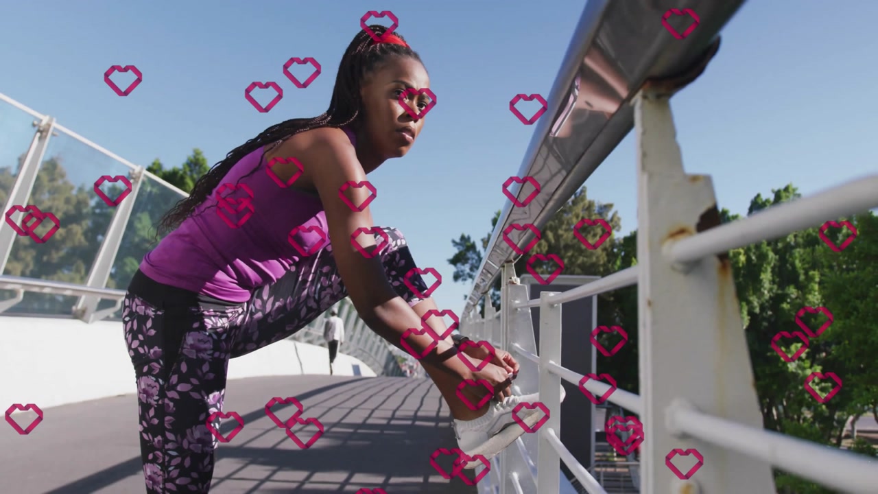 Woman tying sneaker on pedestrian bridge, showcasing health tech concept with heart icon overlays