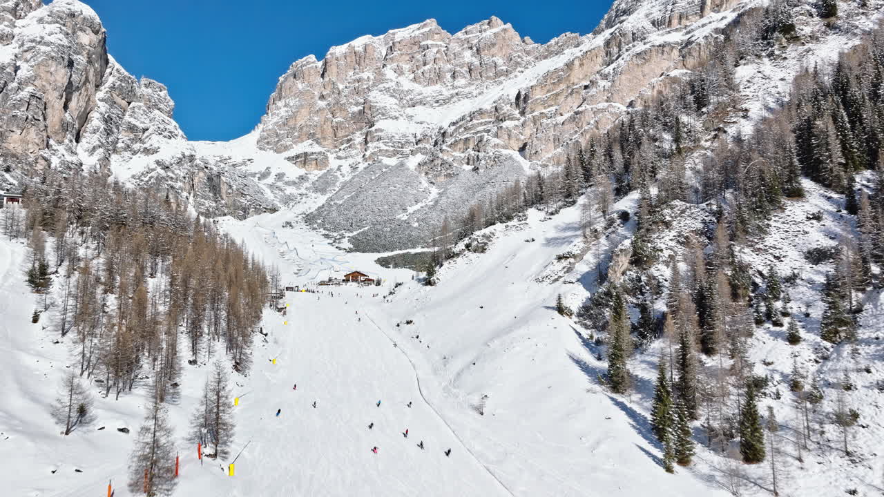 Aerial drone view of the Colfosco ski resort in South Tyrol, Dolomites, Northern Italy