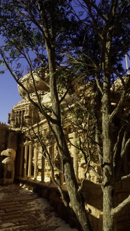 ancient temple ruins surrounded by foliage illuminated by twilight