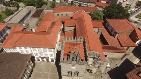 drone flying over senhora da oliveira church in guimarães, portugal