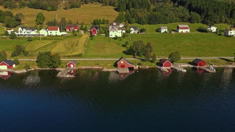 aerial over syvde waterfront on a lovely sunny day, vanylven municipality, norway