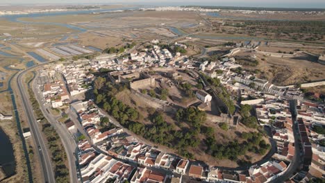 aerial panning shot, ruins of an old fortification and castle in castro marim in portugal