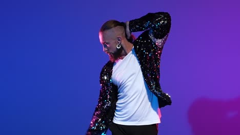 dynamic dance performance in a sequin jacket and hat