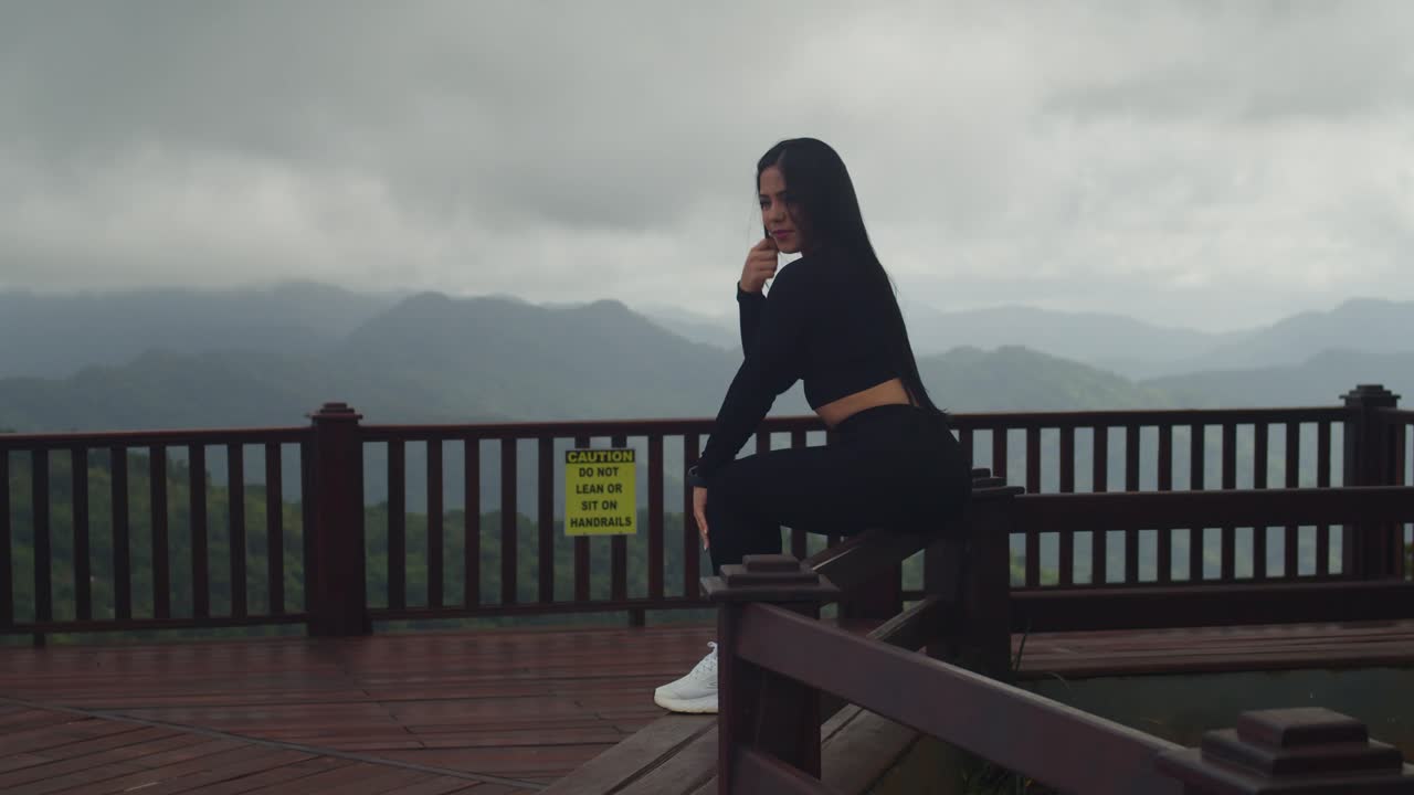 A young Latina feels on top of the tropical world at the breathtaking La Vigie Lookout