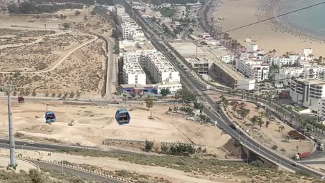 cable car of the aerial tramway connecting oufella peak and agadir city in morocco, overlooking a panoramic view of the beach-13