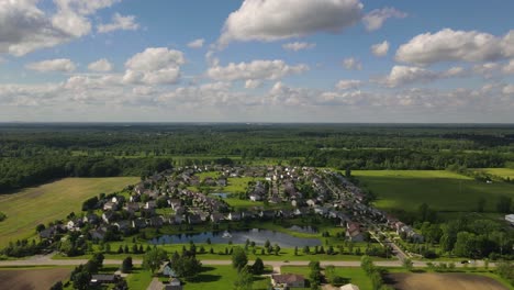 Timelapse-of-residential-area-on-countryside-in-farm-fields,-south-East-Michigan,-USA,-Aerial-view
