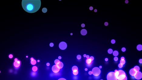glowing circles of light falling on black