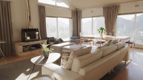 furnished living room interior with large sunny windows, copy space, slow motion