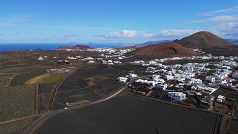 Village-with-only-white-houses-in-volcanic-landscape