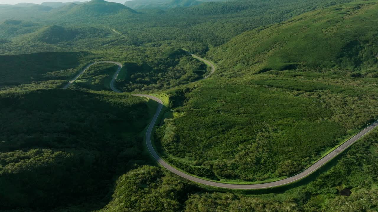 Winding Lanes Of Shiretoko Pass In The Mountain In Japan. - aerial shot